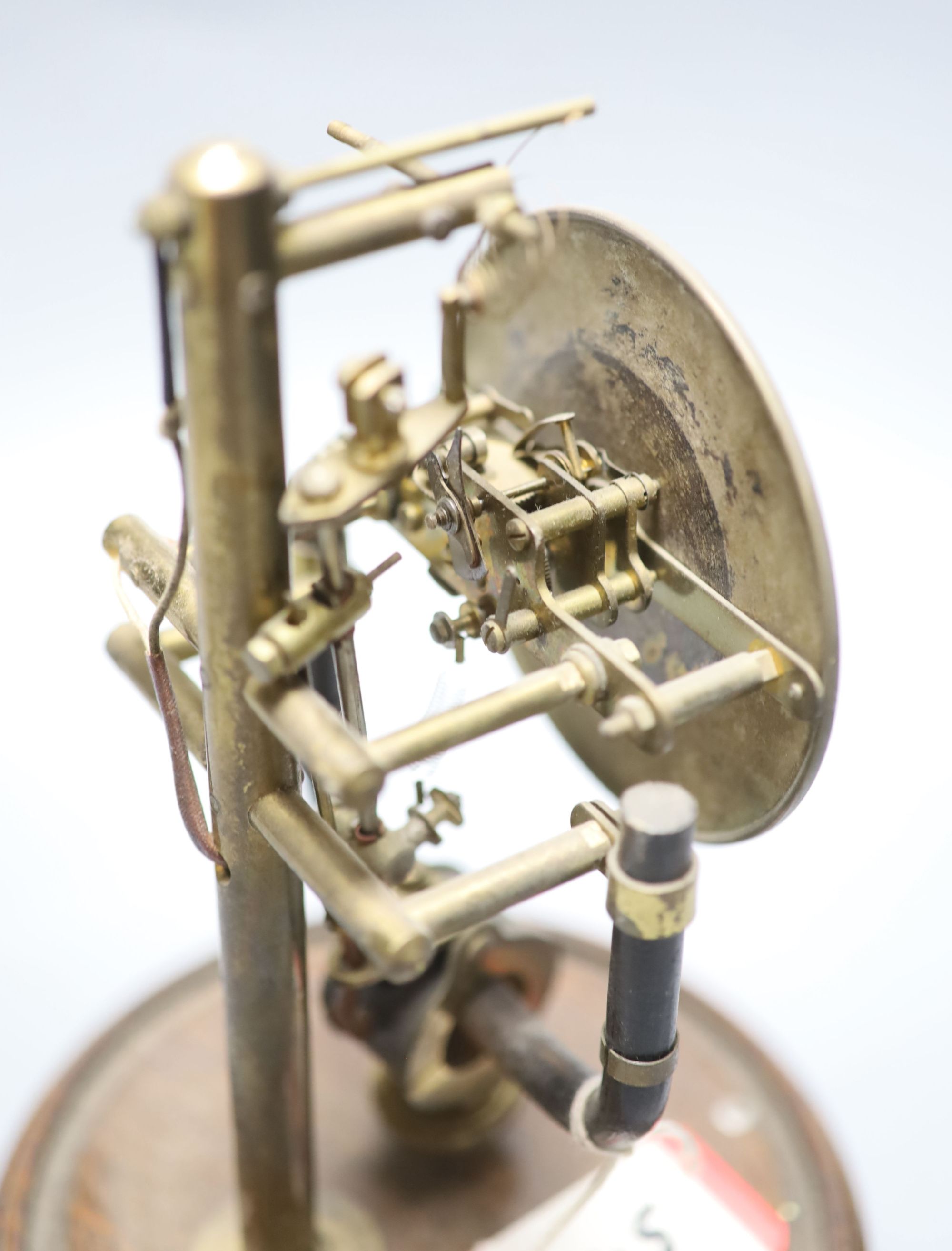 A Bulle type electric mantel timepiece under a dome, overall height 25cm